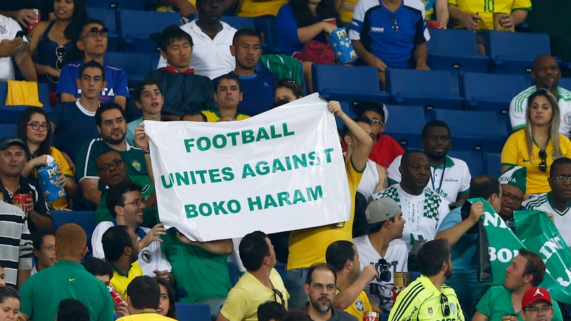 Fans protest against Boko Haram during the World Cup match between Nigeria and Bosnia-Herzegovina