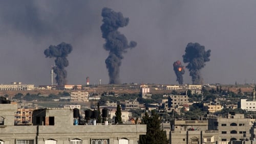 Smoke rises after an Israeli missile hit Gaza earlier today