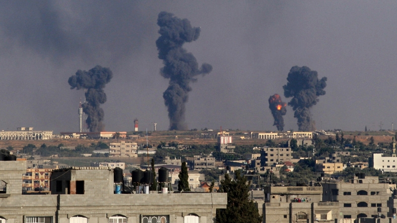 Smoke rises after an Israeli missile hit Gaza earlier today