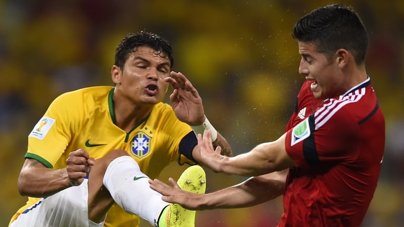 Brazil's captain Thiago Silva vies with Colombia's James Rodriguez