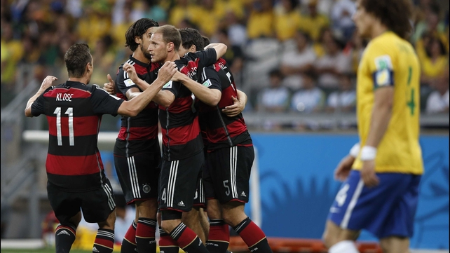 Germany celebrated their early lead, which no one could have predicted would spark a historic scoring spree on the hosts in yellow