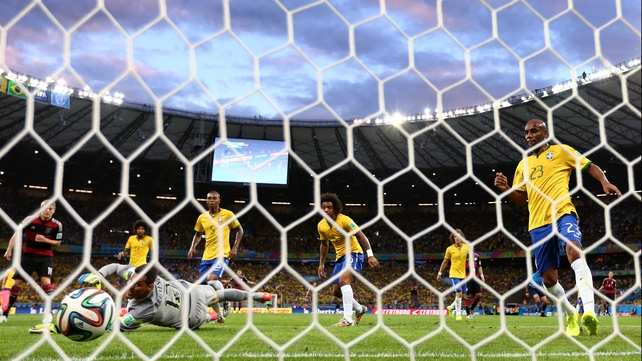 Germany forward Miroslav Klose found a hole in the Brazilian defence at 23'