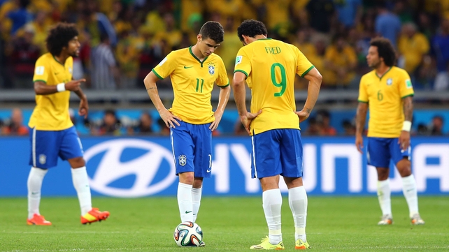 Brazil's Oscar and Fred echoed their keeper's attitude as they prepared to kick off following Germany's fifth goal