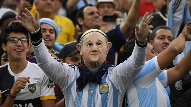 And with the Pope's blessing, the game kicked off