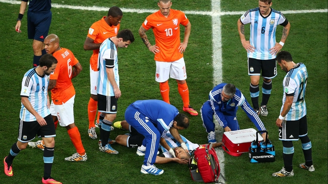 Midway through the first, Argentina midfielder Javier Mascherano went down after a smashing heads with an opposing midfielder