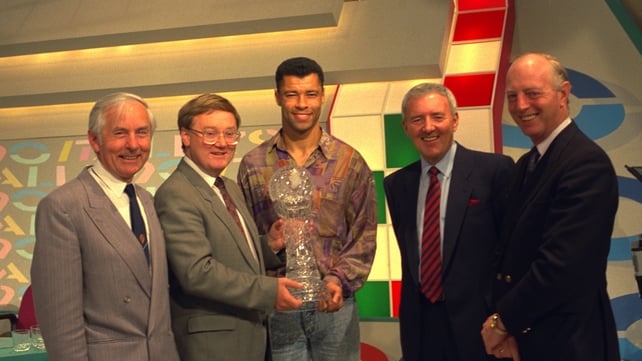 Paul McGrath receives an award after Italia '90