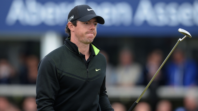 Rory McIlroy acknowledges the applause from the gallery around the 18th green on day two
