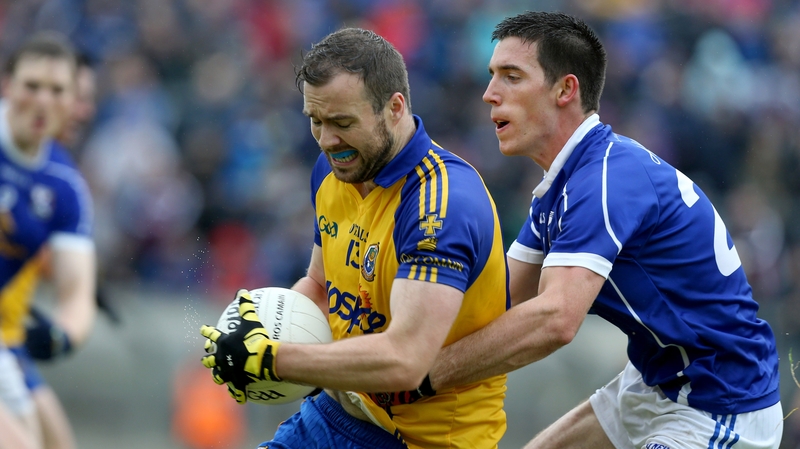 Cavan's Killian Brady strives to dispossess Senan Kilbride of Roscommon