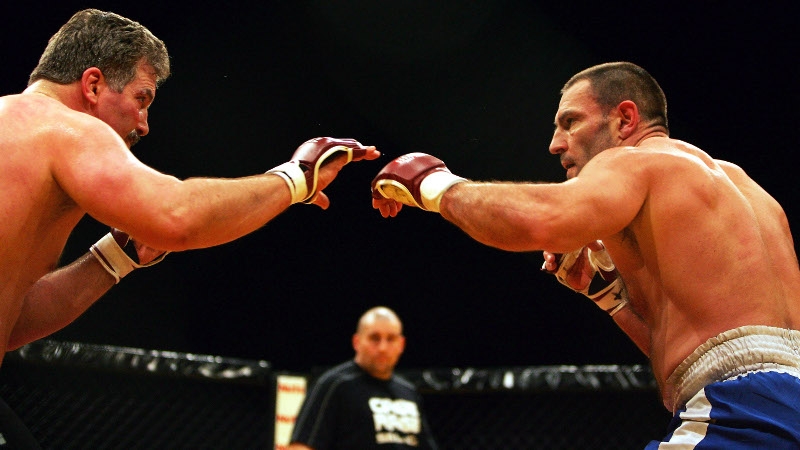 Dave Legeno (right) cage fighting in London in 2007