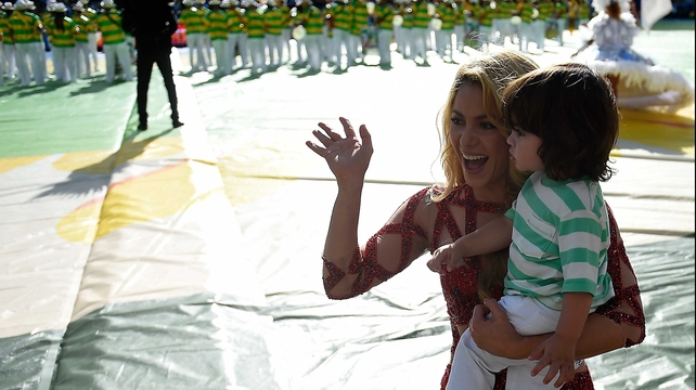 Shakira - seen here holding her son, Milan - strutted her stuff as well