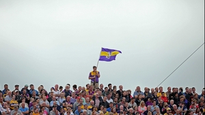 Meanwhile, a lone Wexford fan flies his county colours on the terrace