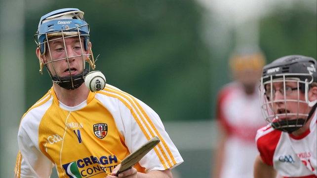 Antrim's James McNaughton in action against Derry's Sean F Quinn in the Ulster hurling final