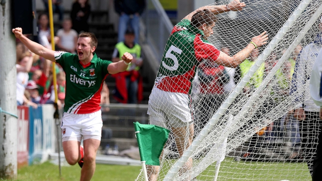 Mayo's Lee Keegan hits the back of the net after scoring a goal as Cillian O'Connor celebrates setting him up