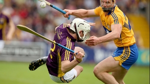 Bang: Liam Ryan of Wexford with John Conlon of Clare