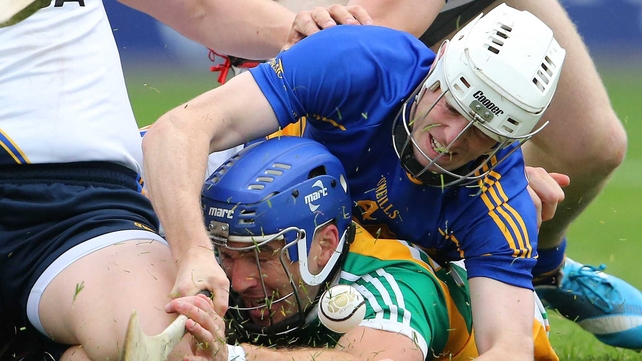 Offaly's Brian Carroll is tackled by Michael Cahill of Tipperary
