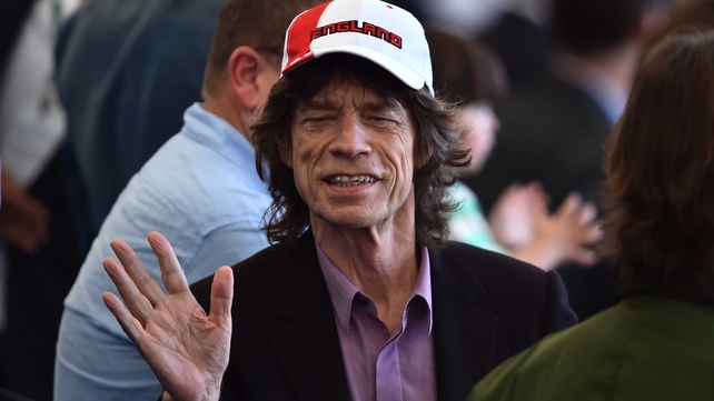 And Mick Jagger enjoyed the atmosphere in Rio, wearing a hat that couldn't possibly cause any more 'jinxing' harm
