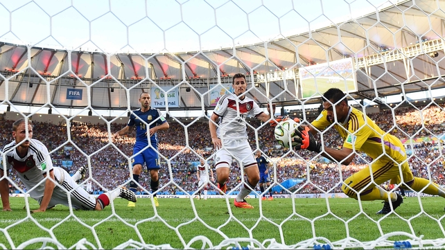 A view of the chaotic play from behind the net