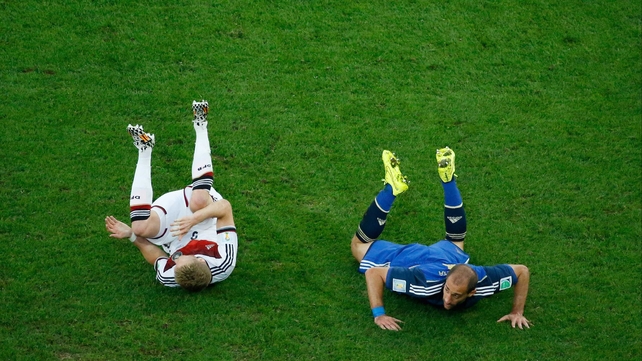 The second half got off to a bit of a stop start, with Argentina earning two yellow cards in two minutes at 65'. Here, Germany forward Andre Schuerrle and Argentina defender Pablo Zabaleta lie on the ground after a clash