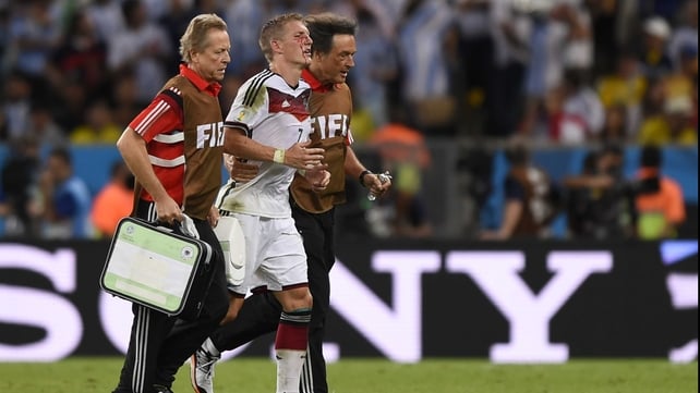 Germany midfielder Bastian Schweinsteiger left the pitch to get patched up after a rough knock that left him bleeding profusely