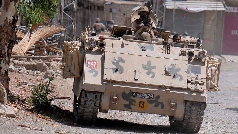 Pakistani soldiers patrol during a military operation against Taliban militants