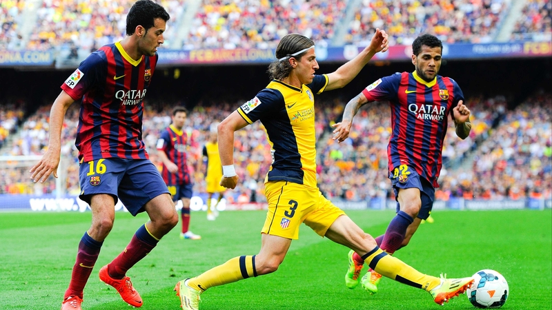 Filipe Luis in action against Barcelona last season