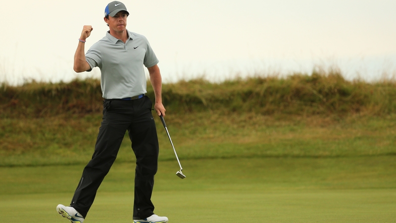 Rory McIlroy celebrates a birdie putt on the 14th green during the third round
