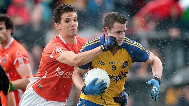 Quite a cheeky tackle on Roscommon's Kevin Higgins by Stephen Harold of Armagh