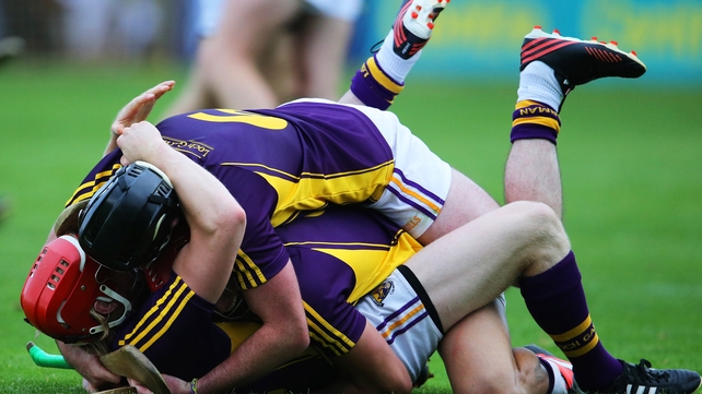 Wexford's Diarmuid O'Keeffe, Lee Chin and Eoin Moore celebrate after the final whistle