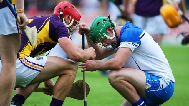Class act: Wexford's Lee Chin consoles Gavin O'Brien of Waterford after the game