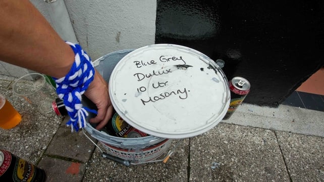 Fans find a novel way of keeping their drinks cool on the streets of Clones