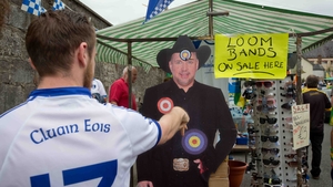 Back in Clones, Ciaran Morgan from Clones throws darts at a cardboard cutout of Garth Brooks at Clones