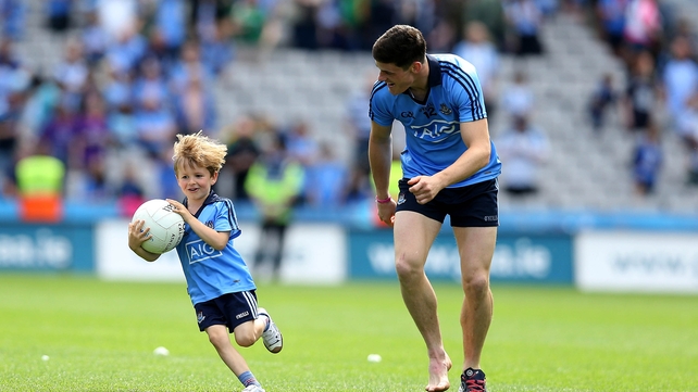 Alan Brogan's son Jamie plays with Diarmuid Connolly after the game