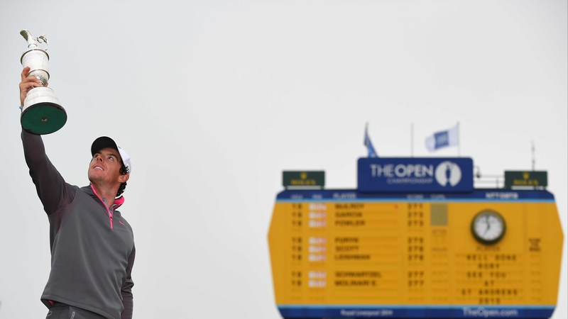 Rory McIlroy holds aloft the famous Claret Jug