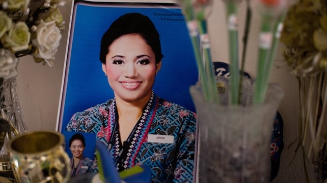 A photograph of Malaysia Airlines MH17 chief flight attendant Azrina Yakob, 41, is seen on a table inside her home in Sungai Pelek, Malaysia