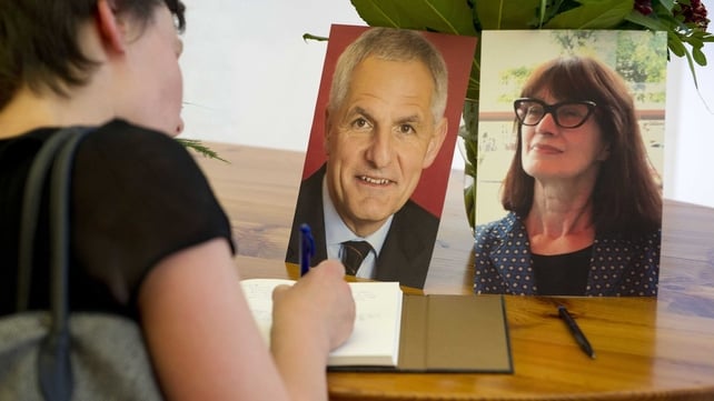 A woman signs the condolence book for Dutch Aids expert Joep Lange and his assistant Jacqueline van Tongeren in the Academic Medical Centre in Amsterdam