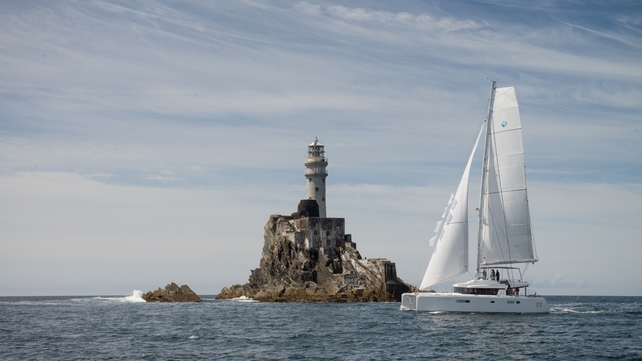 A Lagoon 52 Catamaran rounding the Fastnet Rock on Saturday (Pic: Martin Salmon)
