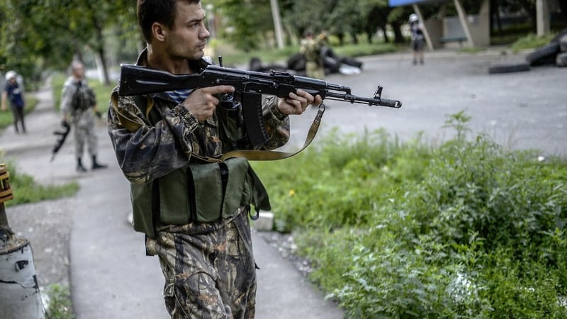 A pro-Russia separatist near the front line in the northern outskirts of city of Donetsk