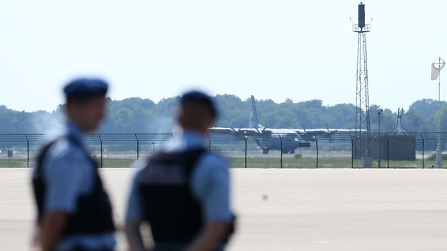 One of the military transport plane carrying the coffins lands at Eindhoven Airport