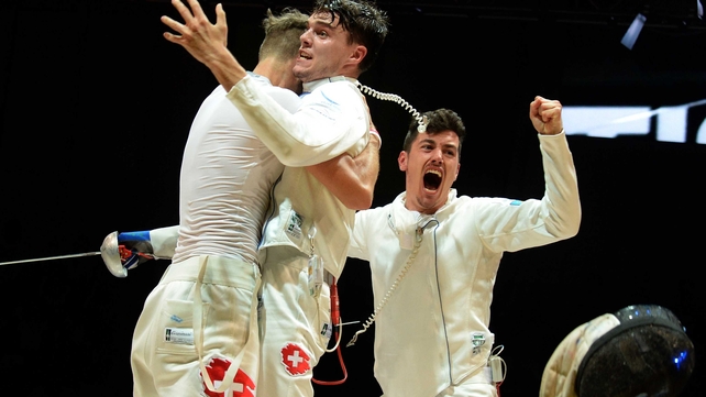 Members of Switzerland's team celebrate after winning the bronze medal during the team epee event at the 2014 World Fencing Championships in Kazan on Wednesday