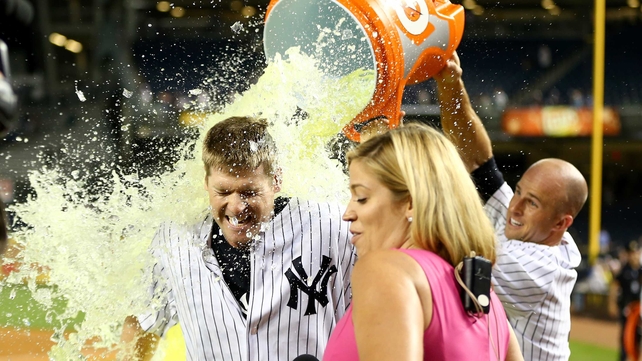 Chase Headley of the New York Yankees gets a Gatorade bath by team-mate Brett Gardner after the game against the Texas Rangers on Wednesday