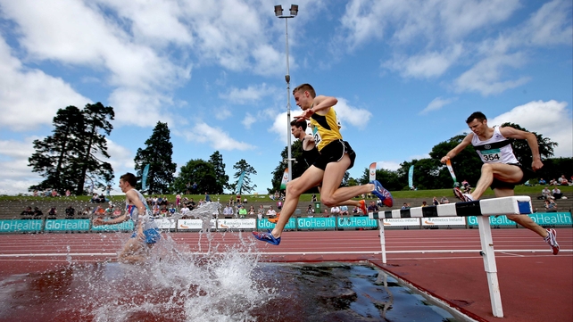 Competitors clear the water jump in the 3,000m steeplechase at the National Championships in in Santry