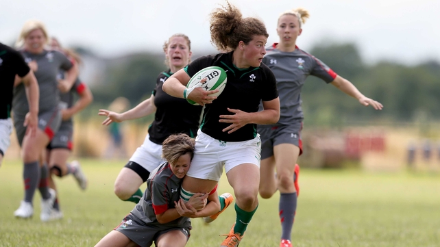 Ireland's Jenny Murphy tackled by Laurie Harries of Wales during an international friendly on Sunday