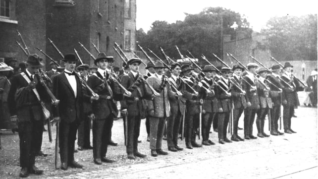 A group of Irish Volunteers stand with some of the rifles from the gun running (Pic: RTÉ Stills Library)