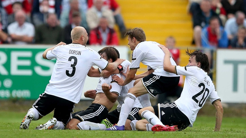 Rosenborg players celebrate Mike Jensen's goal at the Showgrounds