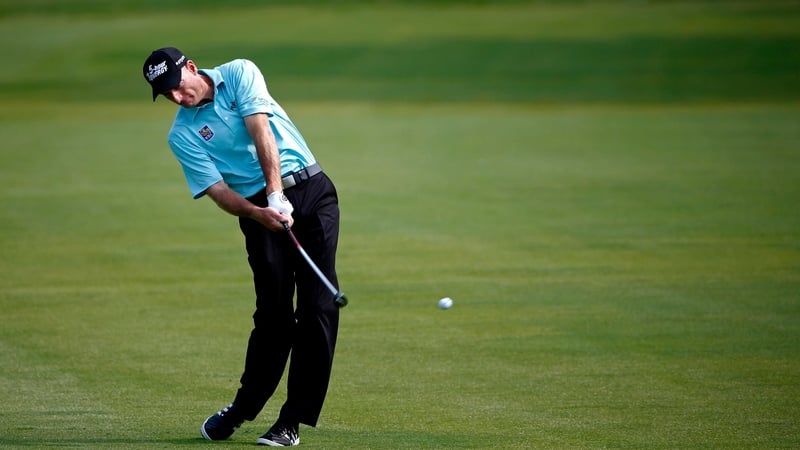 Jim Furyk hits his approach to the 18th green