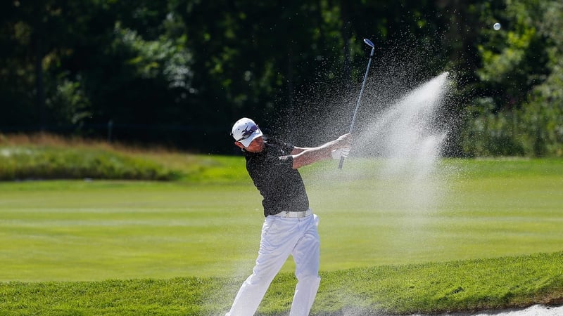 Peter Whiteford hits out of a bunker at the eighth on day three