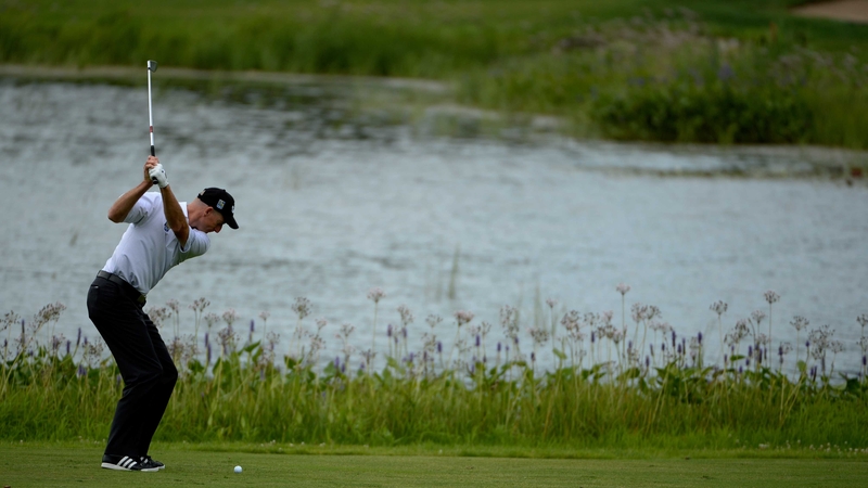 Jim Furyk hits his approach to the 15th hole