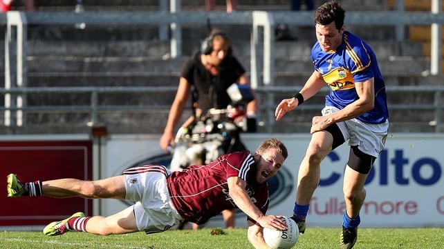 Michael Lundy of Galway with Ciaran McDonald of Tipp