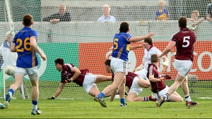Tipperary’s Colin O’Riordan navigates a sea of bodies to score his side's third goal