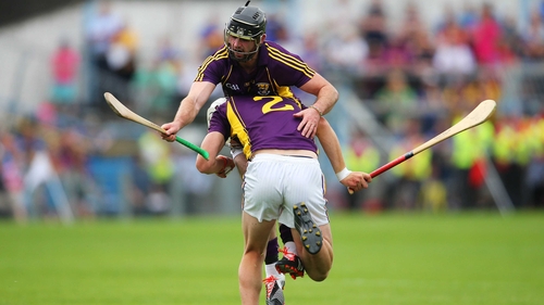 Wexford's Liam Ryan crashes into team-mate Eoin Moore after winning possession during their game against Limerick on Sunday